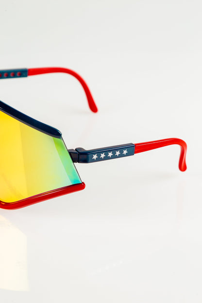  The Cornea Combusters | Red And Blue Revo Retro Macho Sunglasses
