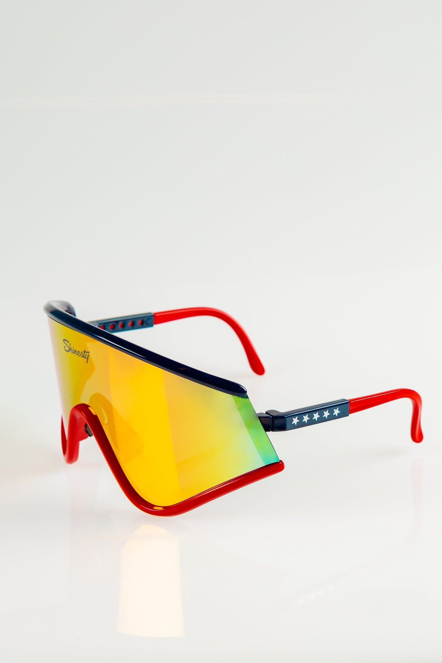  The Cornea Combusters | Red And Blue Revo Retro Macho Sunglasses